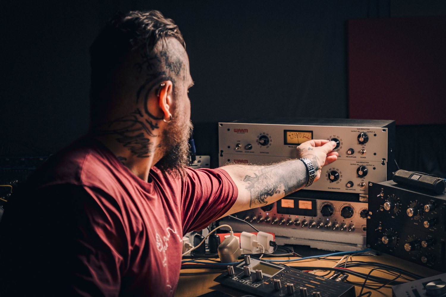 Waldemar working with analog studio equipment